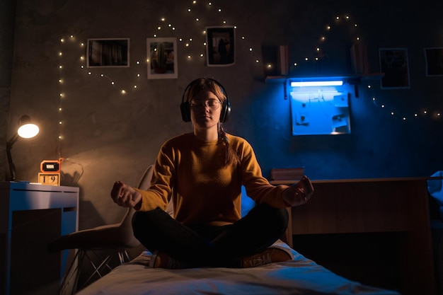 A serene image of a gamer meditating or practicing mindfulness techniques in a quiet, dimly lit room, emphasizing the importance of mental preparation and stress management in gaming.