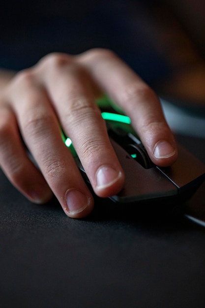 A close-up of a professional gamer's hands swiftly moving across a gaming keyboard and mouse, highlighting the precision and dexterity required for high-level gameplay.