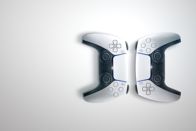 A split-screen image showing the hardware of the PlayStation 5 on one side, and the Xbox Series X on the other. The PS5 is standing vertically, with its white and black design clearly visible. The Xbox Series X is a black rectangular tower.