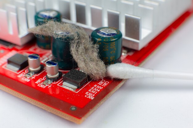 A close-up shot of a Nintendo Switch motherboard, showcasing the components and the precision required for repairs.
