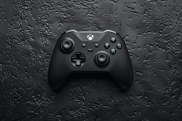 A close-up of the Xbox Series X controller, focusing on the textured grips and redesigned D-pad. The controller is set against a dark background to emphasize its matte finish.