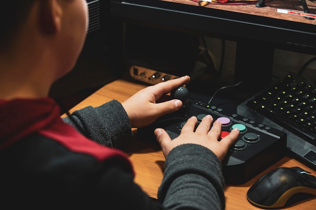 A close-up image of a game developer using a modding tool on a computer, with a console controller and screen displaying game code in the background.