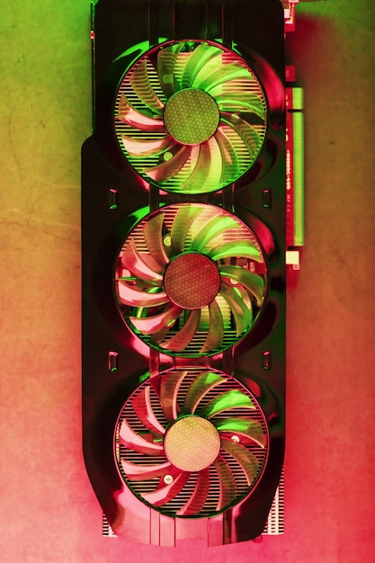 A close-up image of a graphics card inside a gaming PC, with visible heat pipes and cooling fans, emphasizing its critical role in gaming performance.