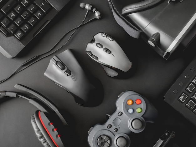 A photo showcasing various third-party PC gaming controllers from different brands, laid out on a table. The image should highlight the diversity in design, color, and features among these controllers.
