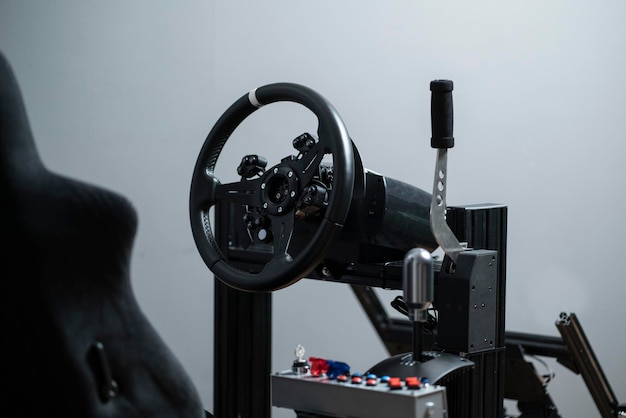 Photo of the Logitech G29 or G920 steering wheel mounted on a racing simulator cockpit, showcasing its compatibility and integration with other gaming accessories. The focus is on the complete gaming setup.
